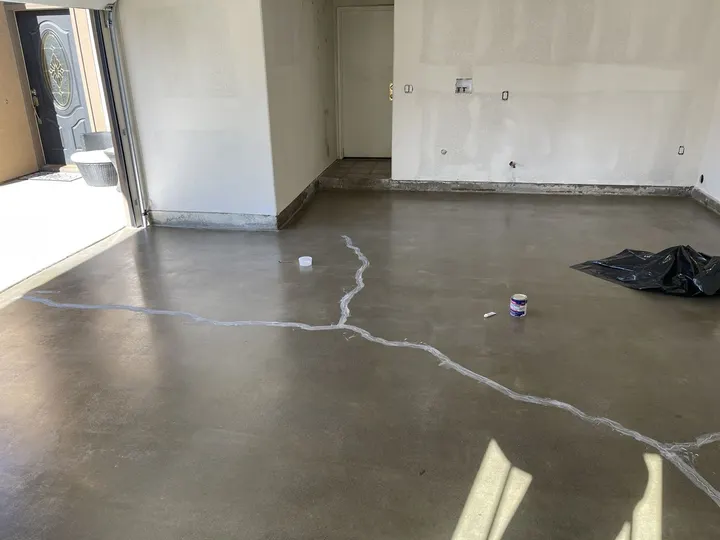 Ground garage slab with cracks filled before coating